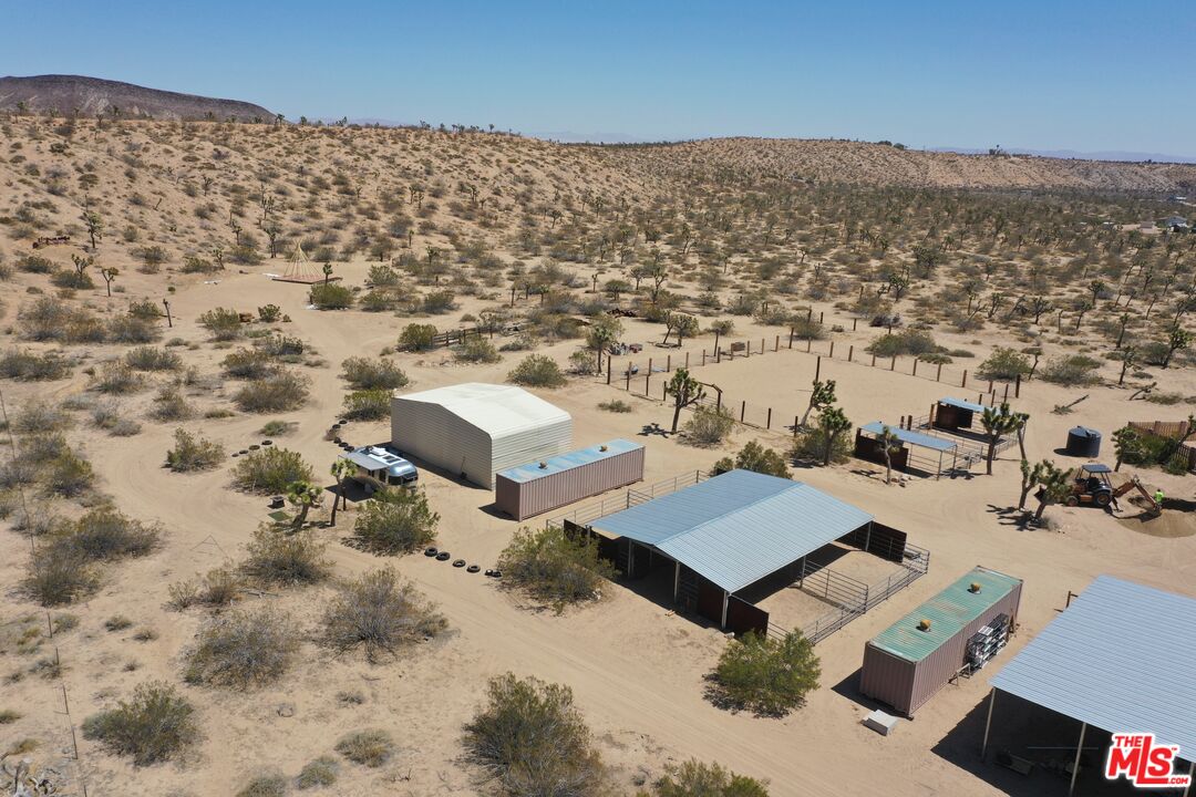 55626 Pipes Canyon Road Yucca Valley, CA 92284 - Photo 60 of 61 an aerial view of a house with a yard