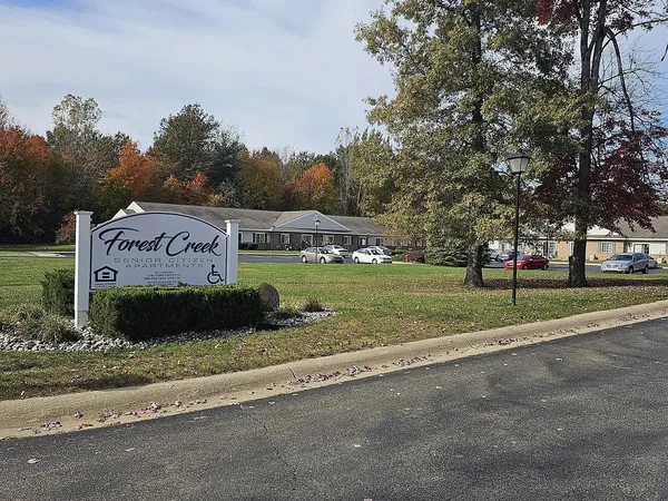 a view of a park with welcome board