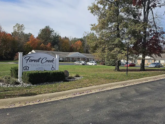a view of a park with welcome board