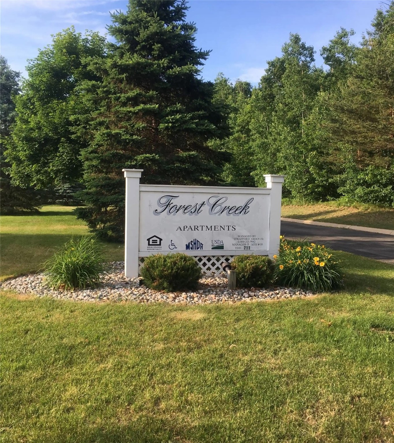 286 Clark Street Montrose, MI 48457 - Photo 3 of 6 a view of a garden with plants and large trees