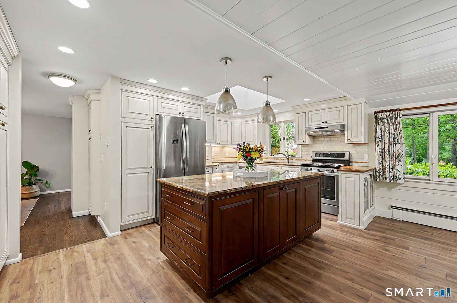19 Geneva Road Norwalk, CT 06850 - Photo 11 of 33 a kitchen with granite countertop a sink and a refrigerator