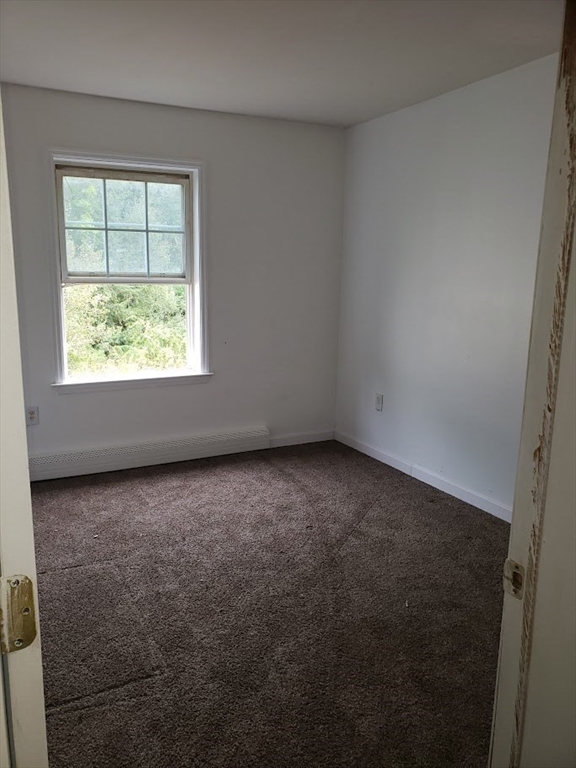 21 Spencer Road Oakham, MA 01068 - Photo 11 of 25 an empty room with a window