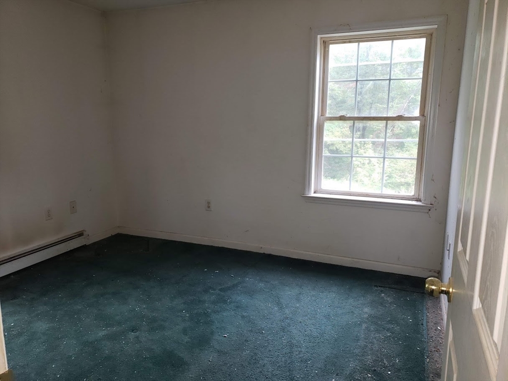 21 Spencer Road Oakham, MA 01068 - Photo 14 of 25 an empty room with a window