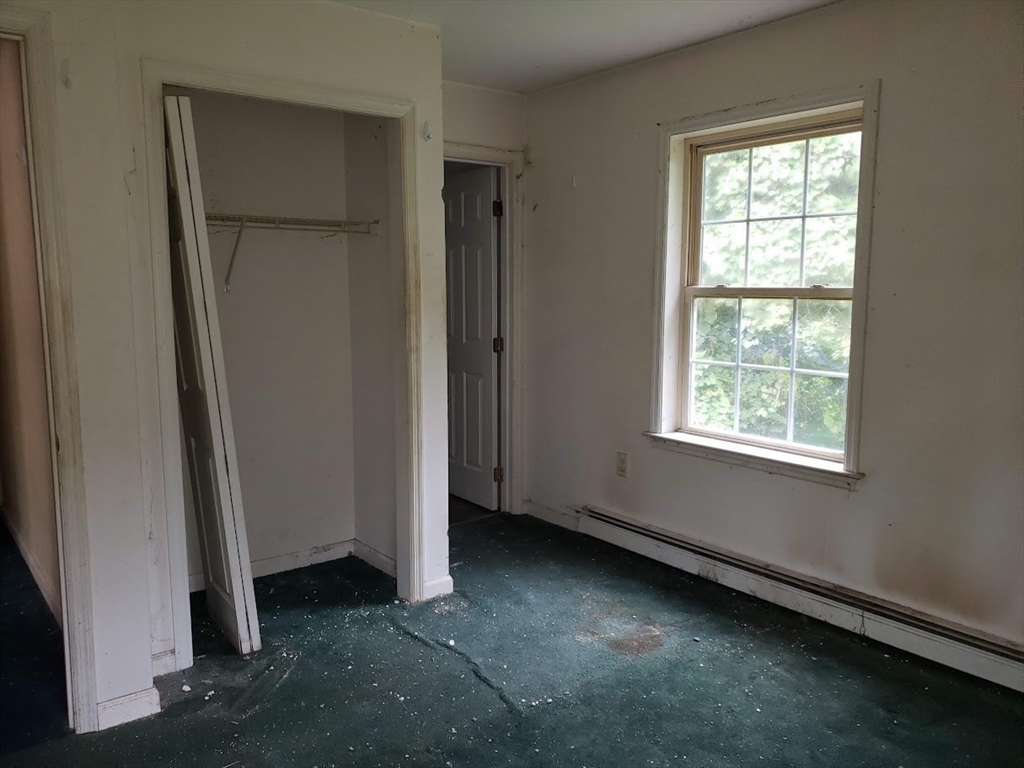 21 Spencer Road Oakham, MA 01068 - Photo 15 of 25 an empty room with windows and closet