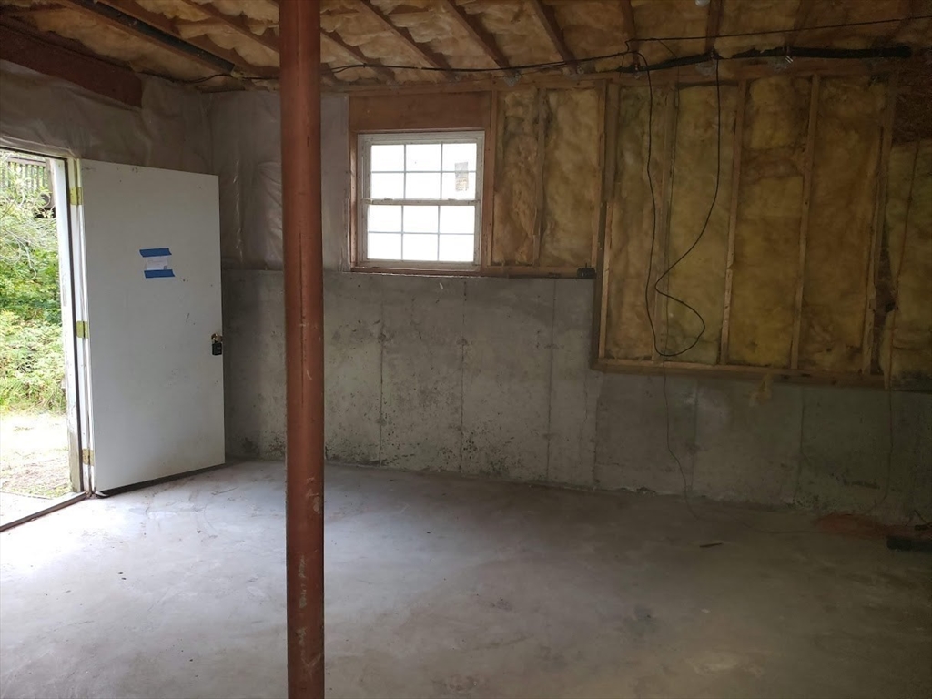 21 Spencer Road Oakham, MA 01068 - Photo 18 of 25 a view of an empty room with a window