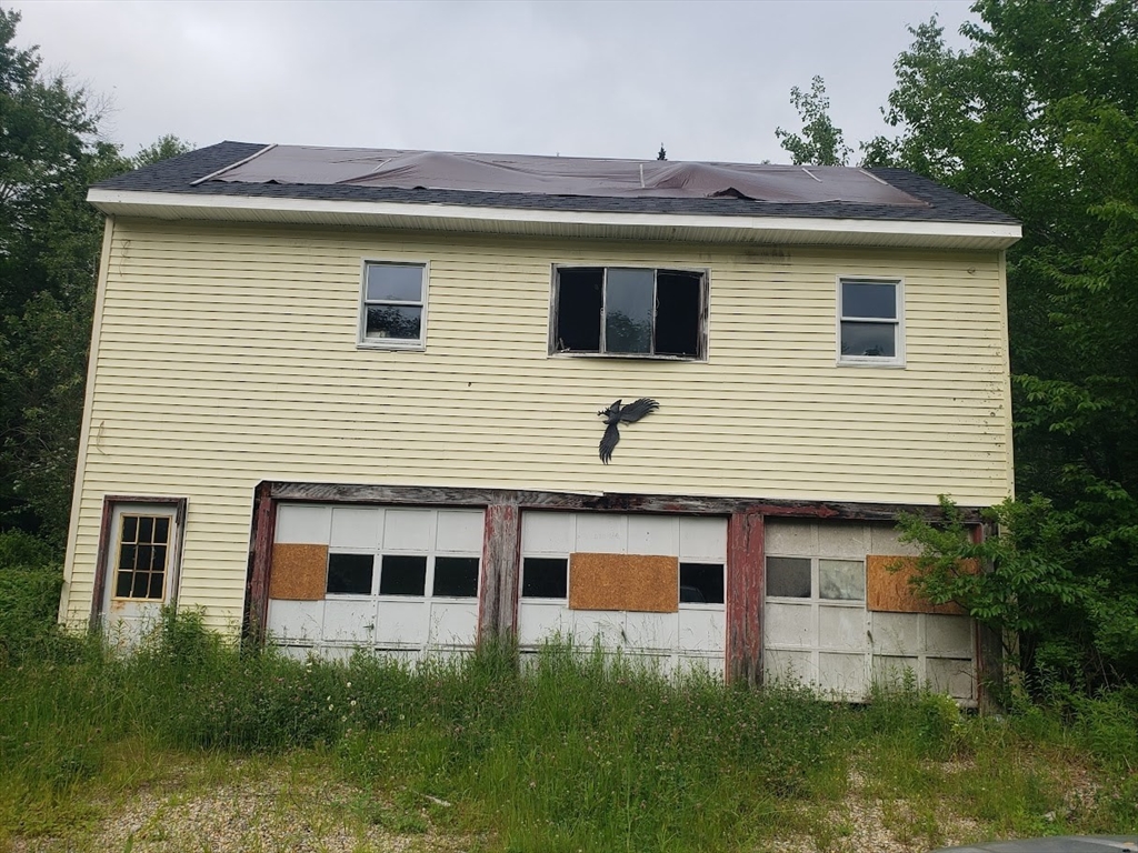 21 Spencer Road Oakham, MA 01068 - Photo 25 of 25 a front view of a house with plants