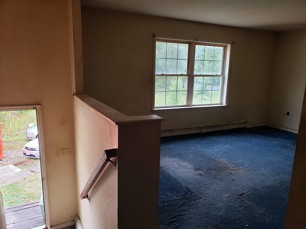 21 Spencer Road Oakham, MA 01068 - Photo 4 of 25 an empty room with windows
