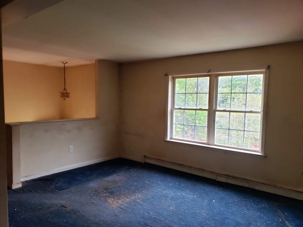 21 Spencer Road Oakham, MA 01068 - Photo 5 of 25 an empty room with a window