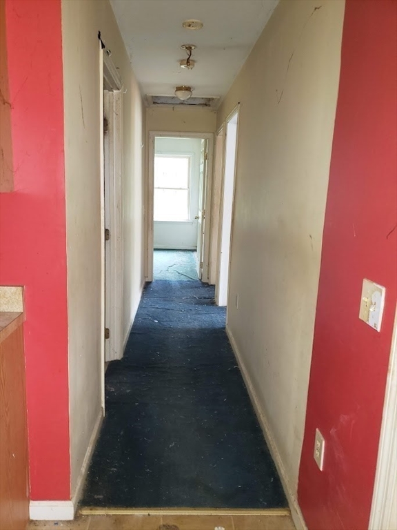 21 Spencer Road Oakham, MA 01068 - Photo 7 of 25 a view of a hallway with wooden floor