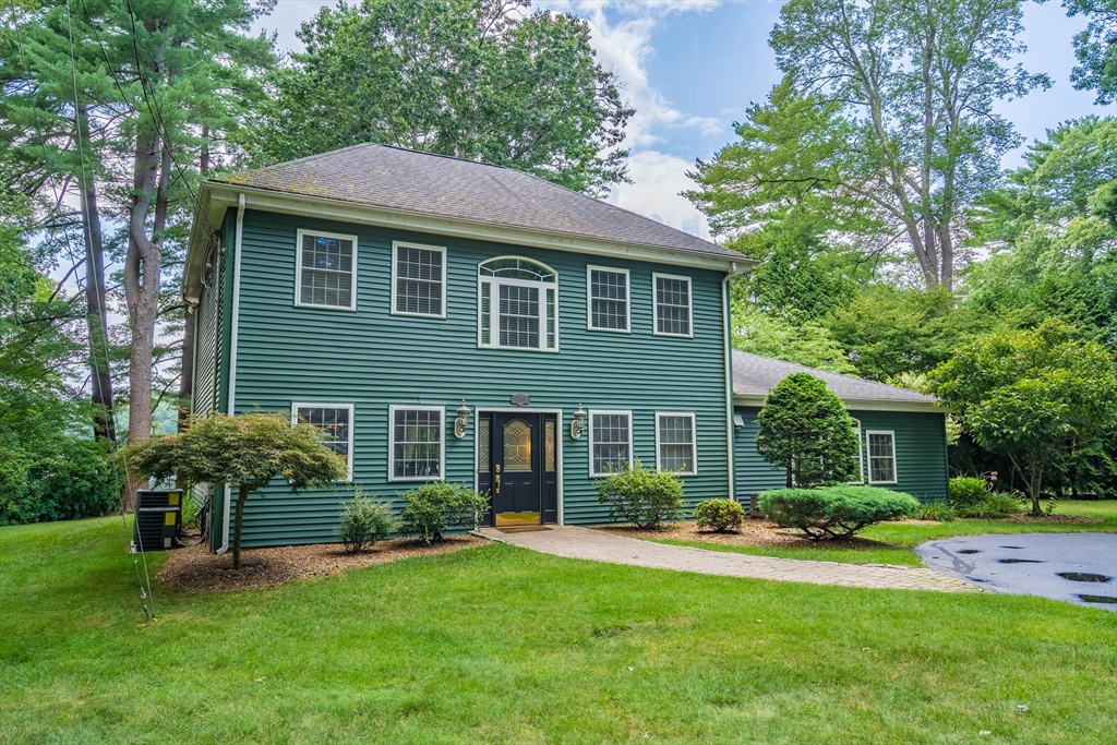 33 Mountain Brook Road Sturbridge, MA 01566 - Photo 1 of 41 a front view of a house with a yard and green space