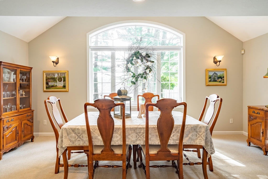 33 Mountain Brook Road Sturbridge, MA 01566 - Photo 13 of 41 a view of a dining room with furniture large windows and wooden floor