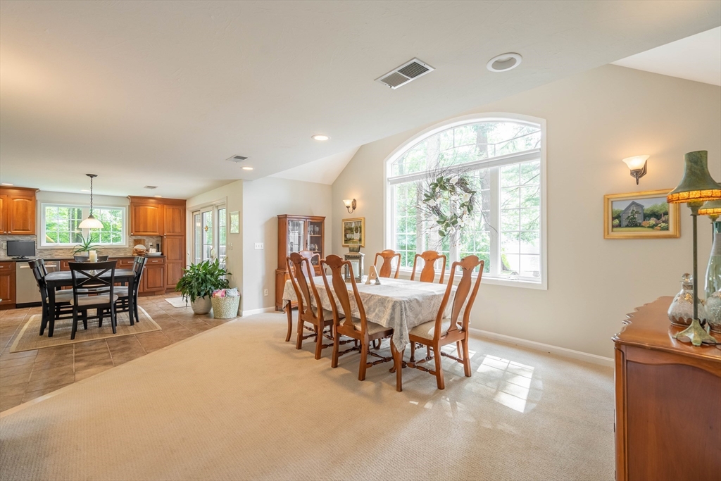 33 Mountain Brook Road Sturbridge, MA 01566 - Photo 14 of 41 a dining room with furniture a chandelier and wooden floor