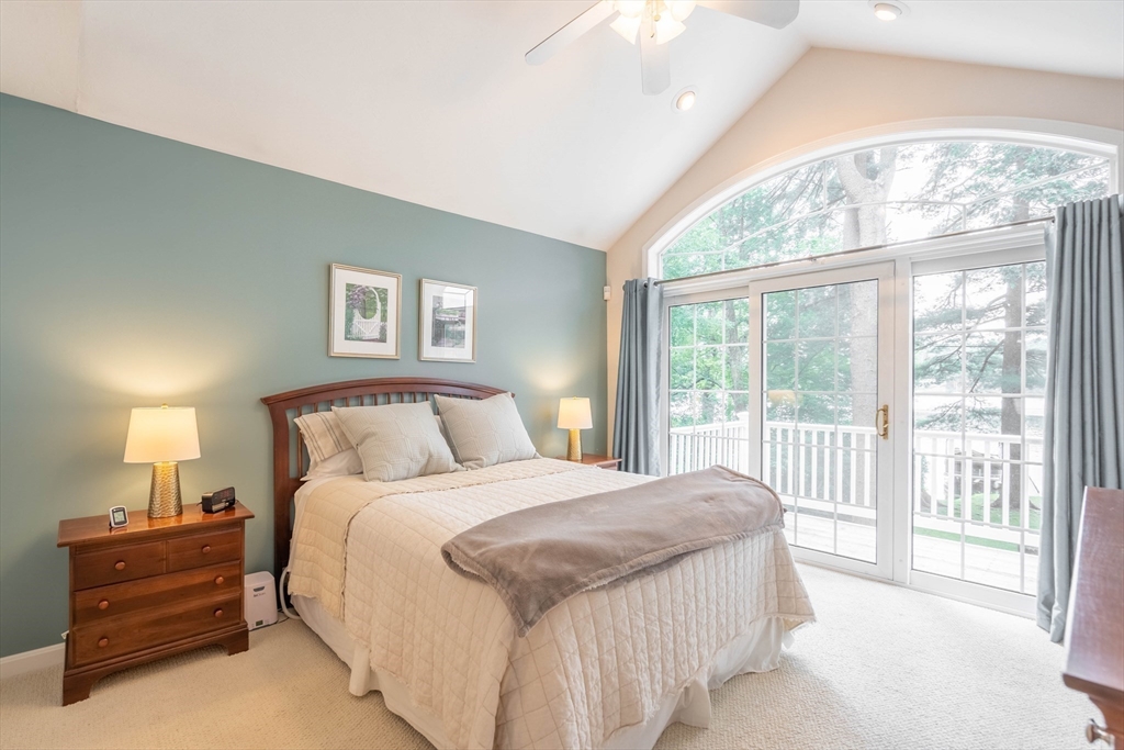 33 Mountain Brook Road Sturbridge, MA 01566 - Photo 19 of 41 a bedroom with a large bed and a large window