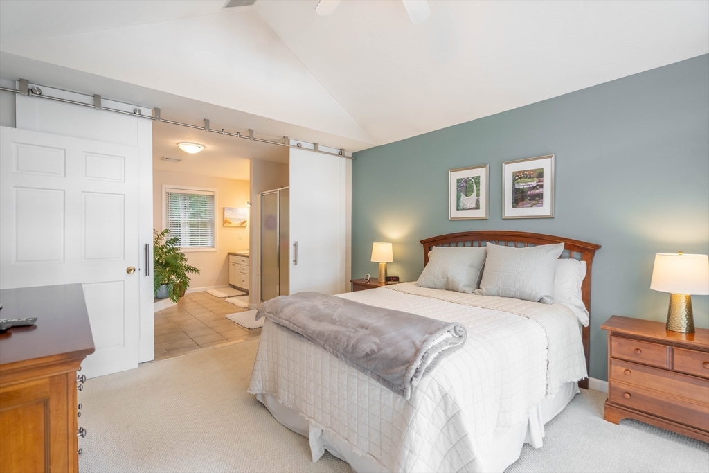 33 Mountain Brook Road Sturbridge, MA 01566 - Photo 20 of 41 a spacious bedroom with a bed and a couch
