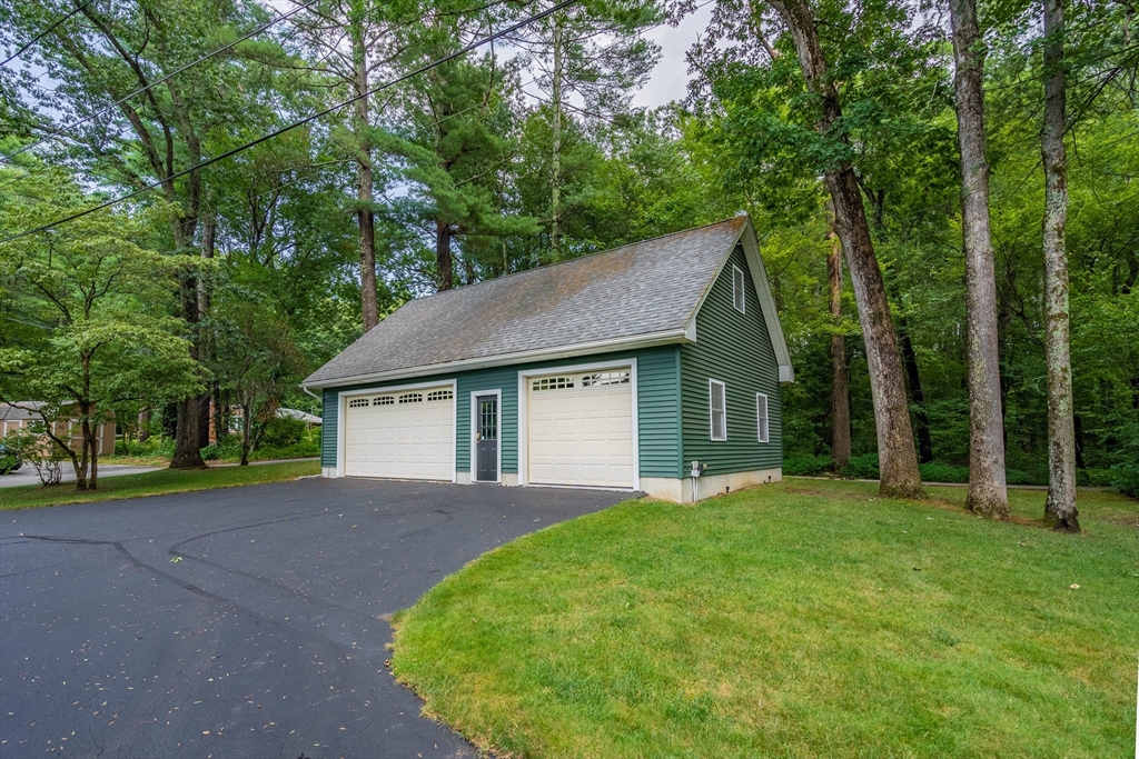 33 Mountain Brook Road Sturbridge, MA 01566 - Photo 2 of 41 a front view of a house with yard and green space