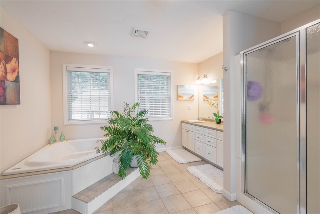 33 Mountain Brook Road Sturbridge, MA 01566 - Photo 21 of 41 a bathroom with a granite countertop bathtub sink vanity mirror and toilet
