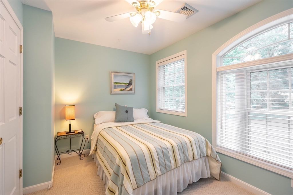 33 Mountain Brook Road Sturbridge, MA 01566 - Photo 25 of 41 a bedroom with a bed and a window
