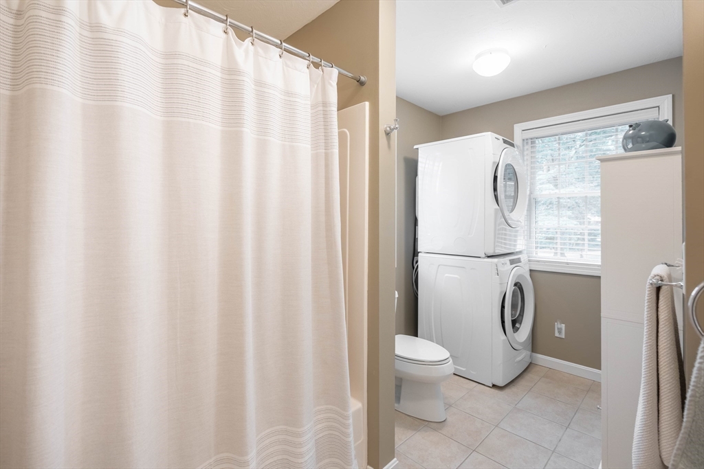 33 Mountain Brook Road Sturbridge, MA 01566 - Photo 28 of 41 a bathroom with a shower curtain