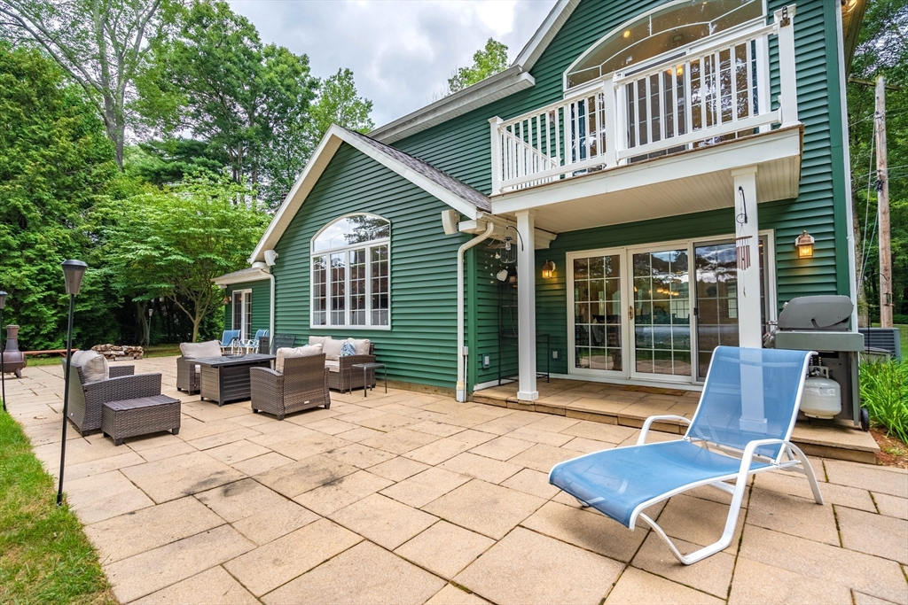 33 Mountain Brook Road Sturbridge, MA 01566 - Photo 29 of 41 a view of a patio with couches table and chairs and potted plants