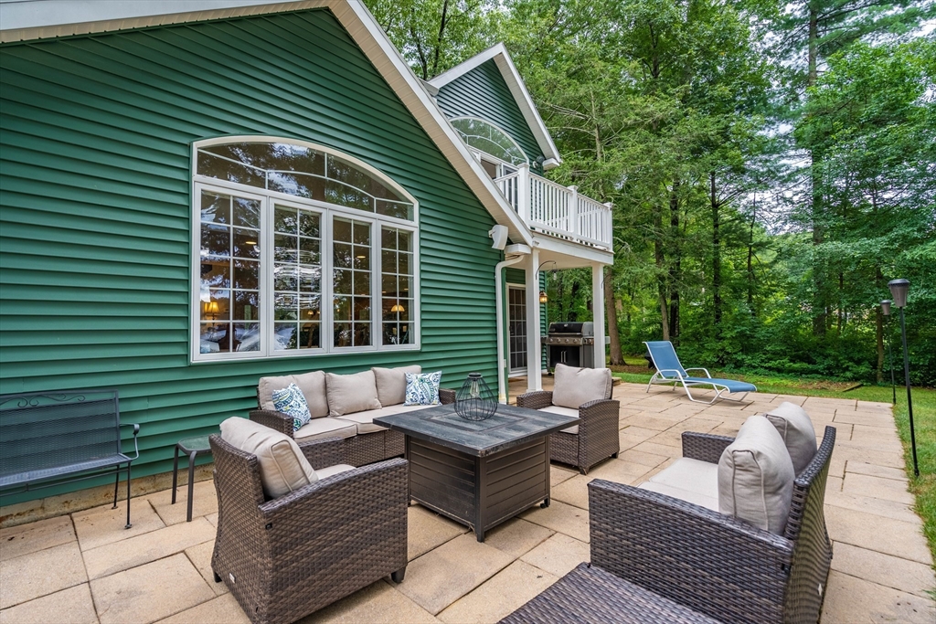 33 Mountain Brook Road Sturbridge, MA 01566 - Photo 30 of 41 a view of a patio with couches table and chairs and potted plants