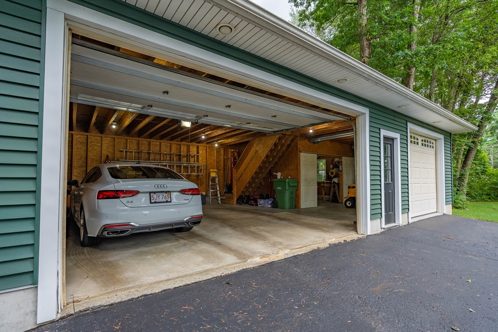 33 Mountain Brook Road Sturbridge, MA 01566 - Photo 32 of 41 a car parked in garage