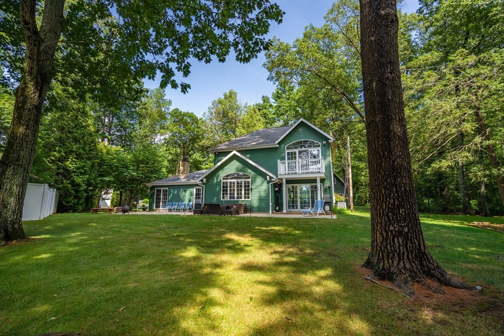 33 Mountain Brook Road Sturbridge, MA 01566 - Photo 6 of 41 a front view of a house with a yard
