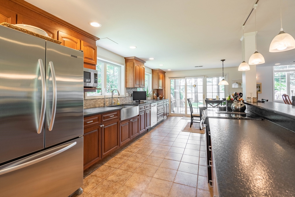 33 Mountain Brook Road Sturbridge, MA 01566 - Photo 8 of 41 a large kitchen with stainless steel appliances lots of counter top space