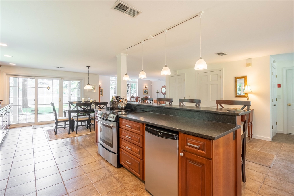 33 Mountain Brook Road Sturbridge, MA 01566 - Photo 9 of 41 a kitchen with a sink and cabinets