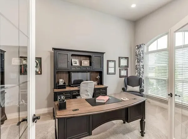 a workspace with furniture and window