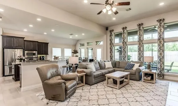 a living room with furniture and a large window