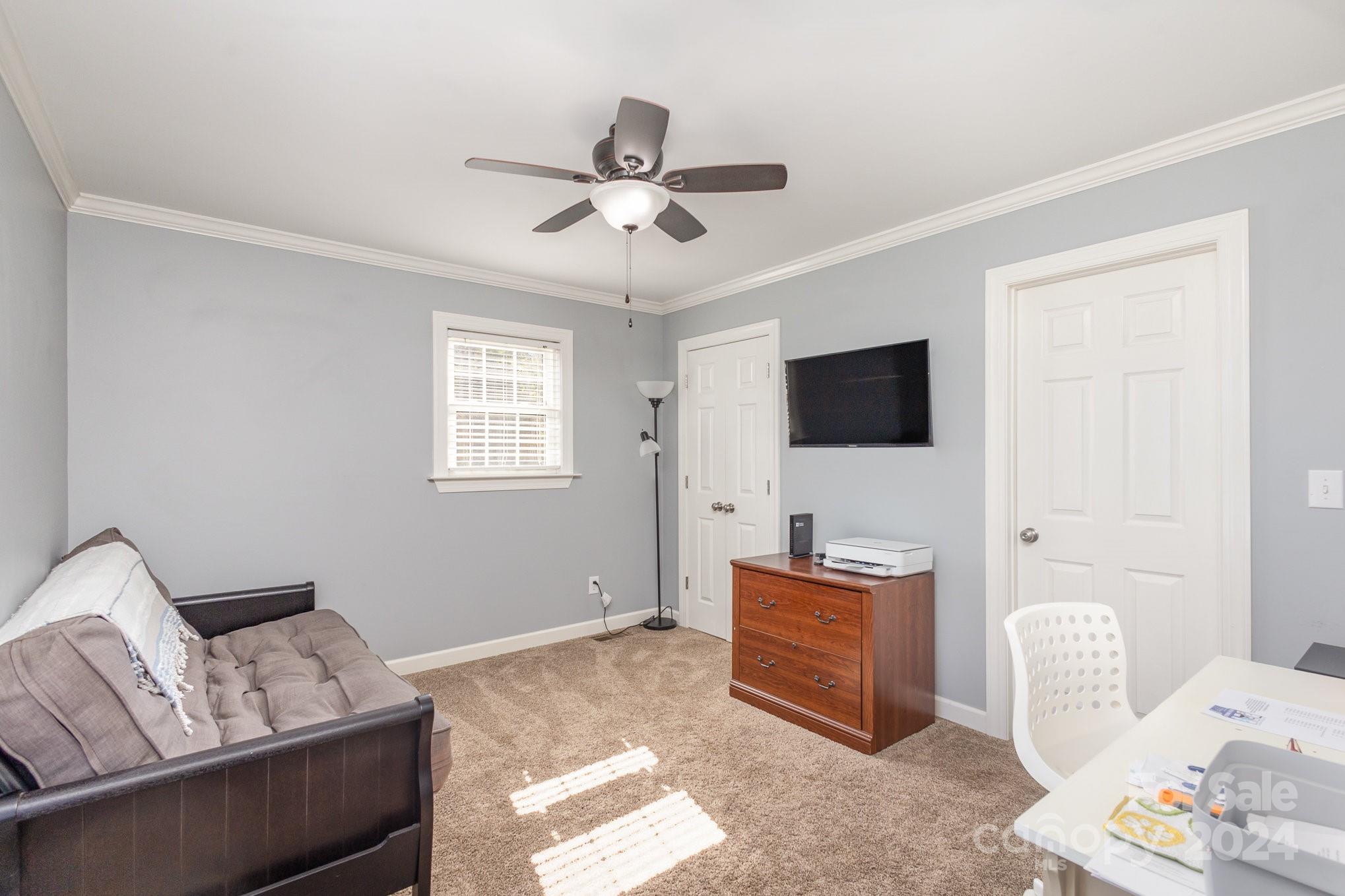 13512 Five Point Road Locust, NC 28097 - Photo 19 of 31 a living room with furniture and a flat screen tv