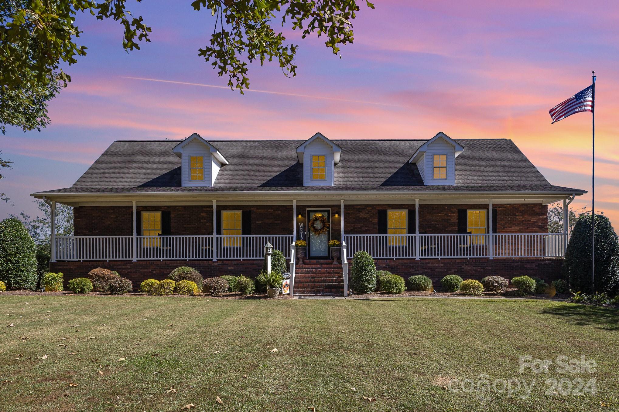 13512 Five Point Road Locust, NC 28097 - Photo 2 of 31 a front view of a house with garden
