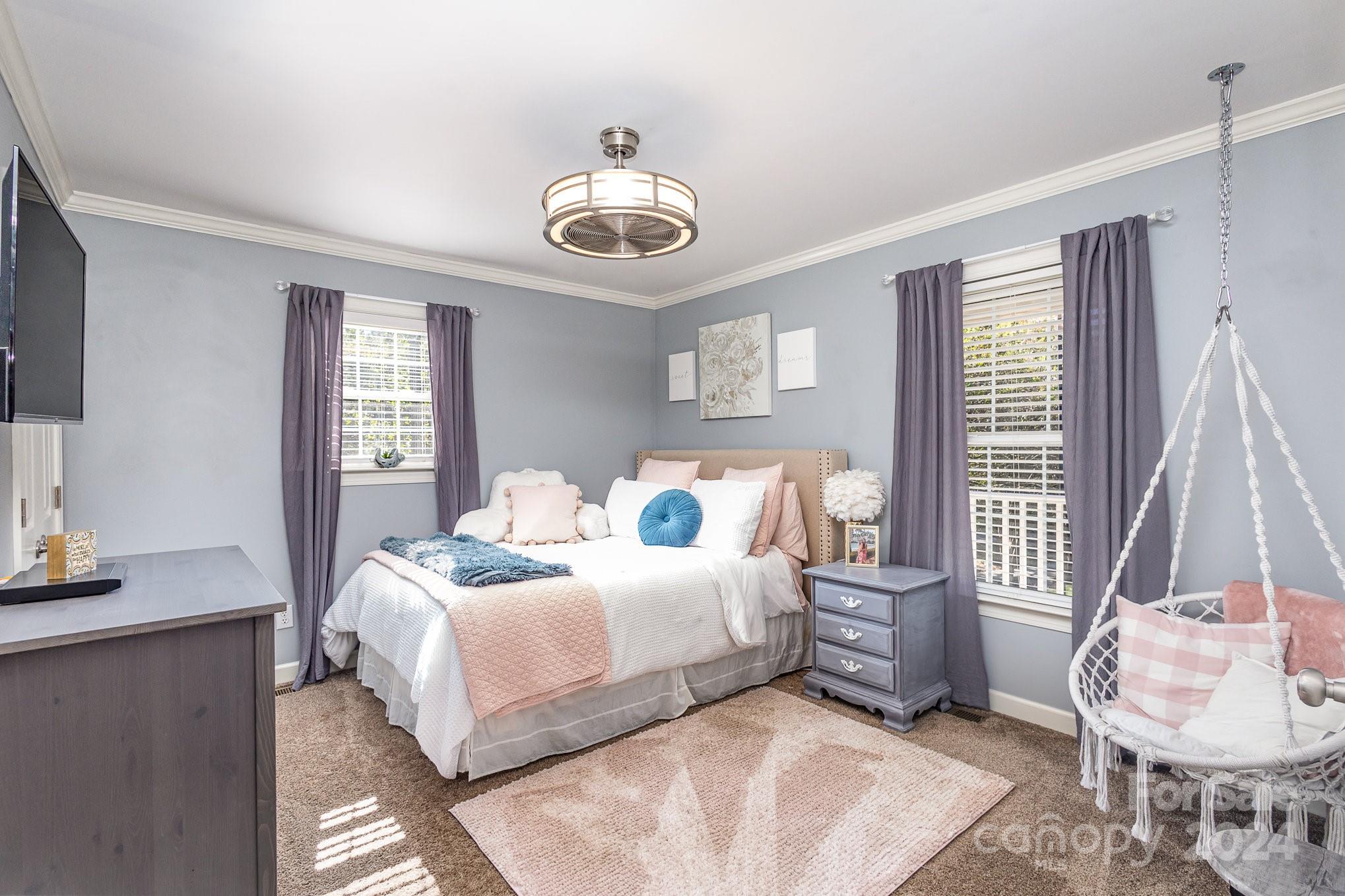 13512 Five Point Road Locust, NC 28097 - Photo 22 of 31 a bedroom with a bed and a chair
