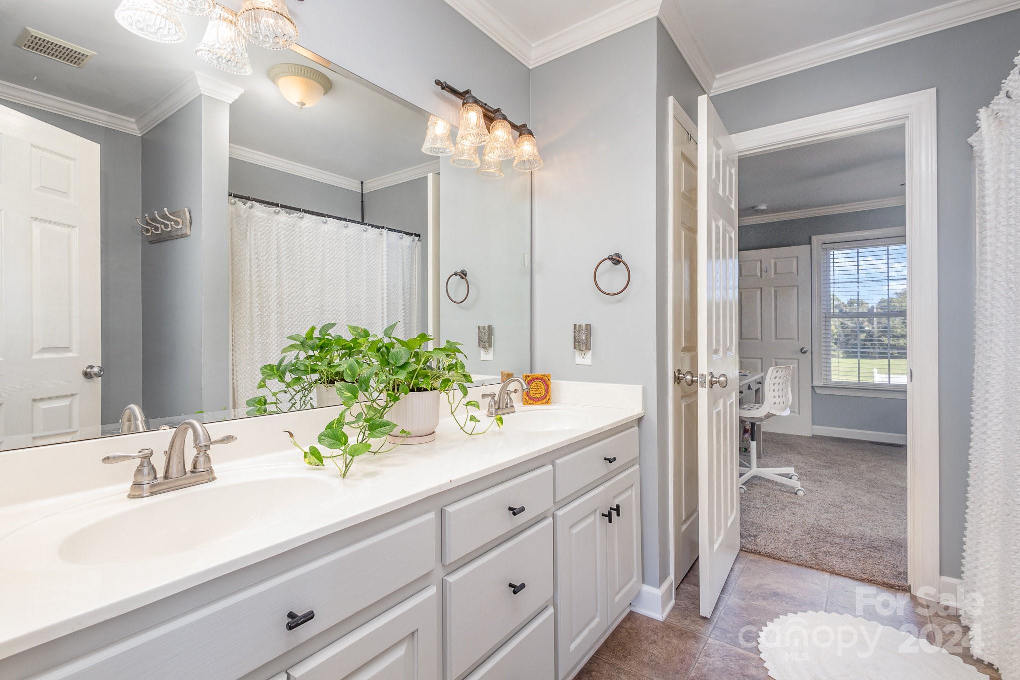 13512 Five Point Road Locust, NC 28097 - Photo 23 of 31 a bathroom with a sink and a mirror