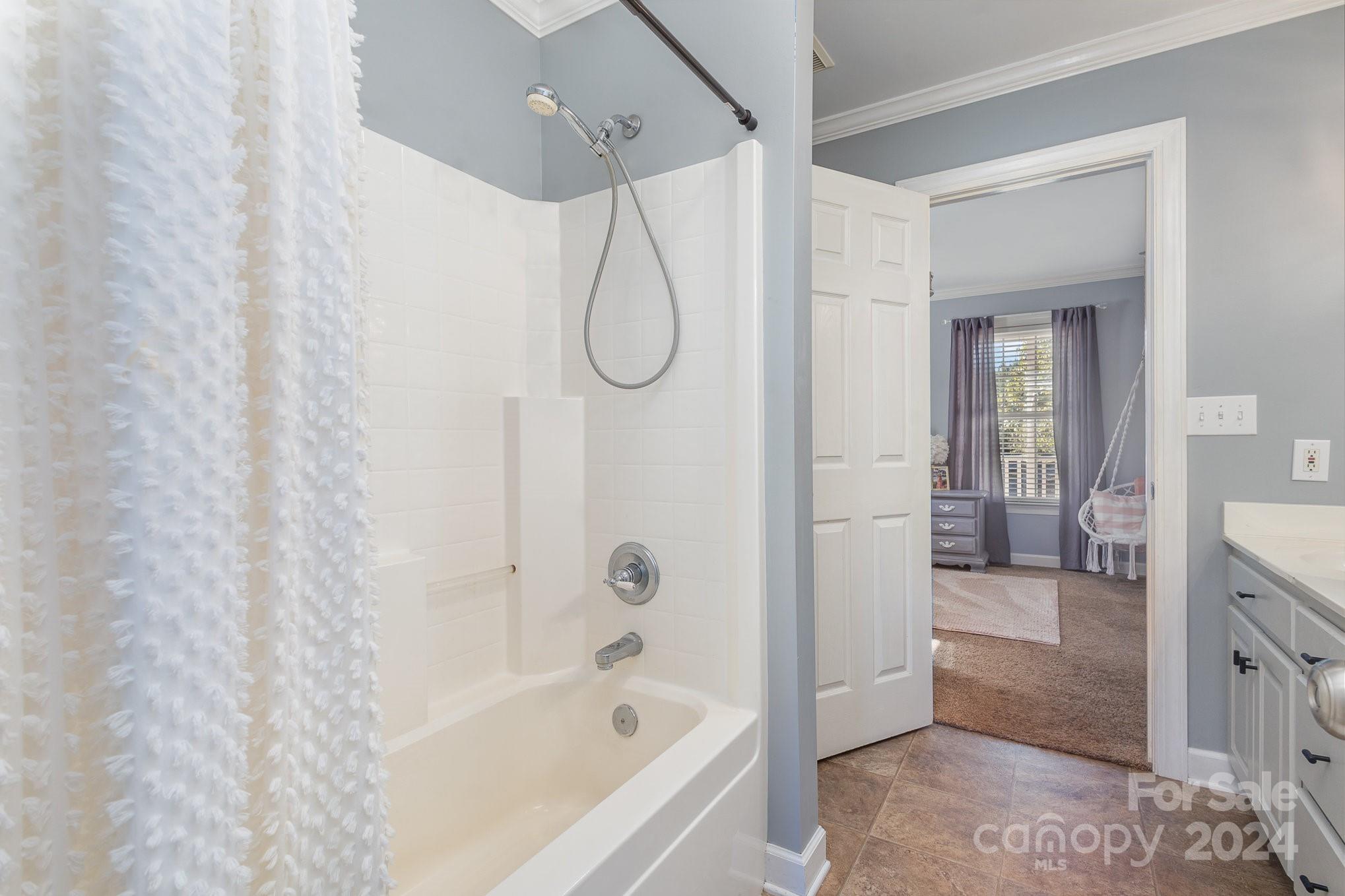 13512 Five Point Road Locust, NC 28097 - Photo 24 of 31 a bathroom with a bath tub and shower