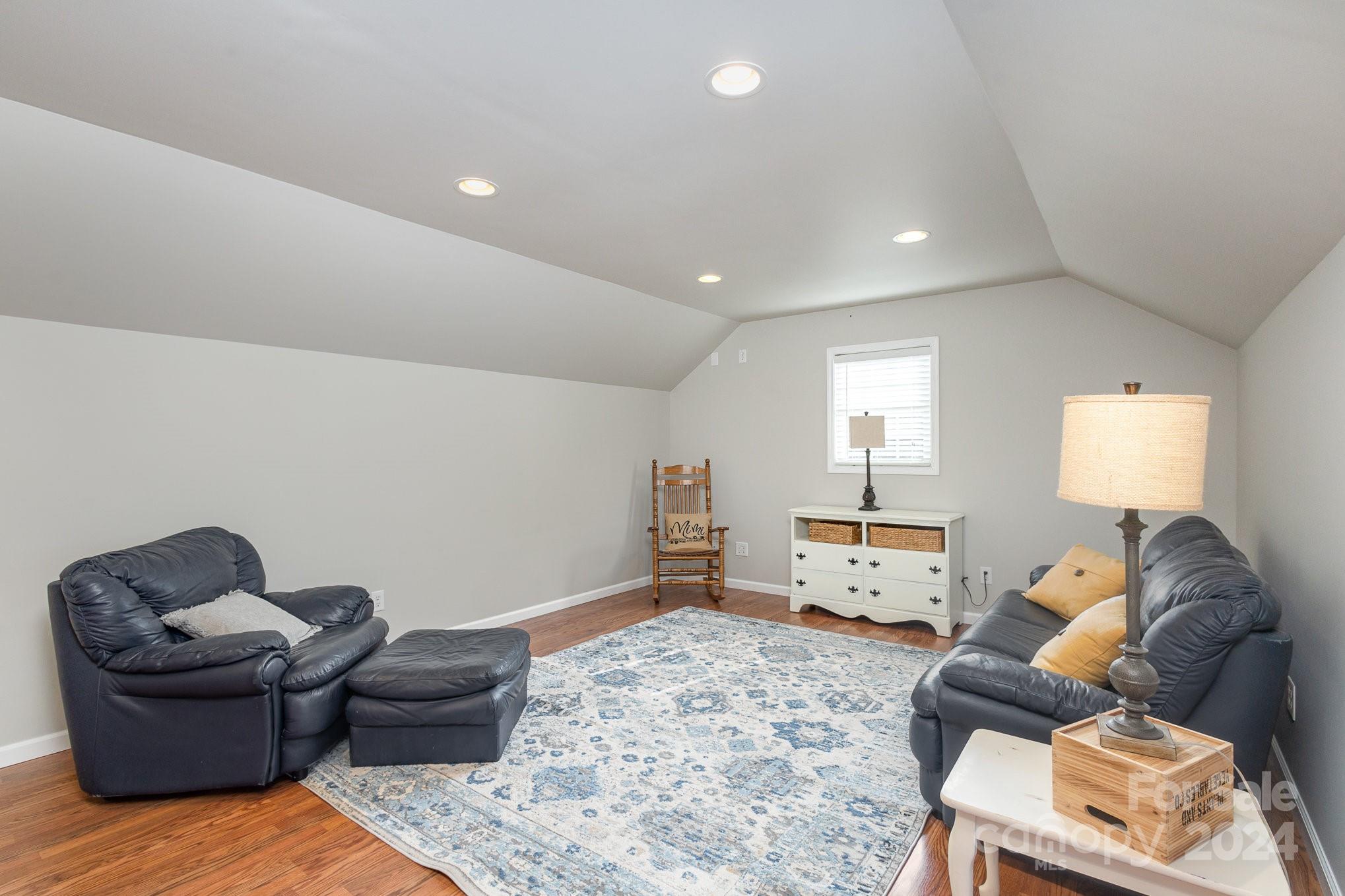 13512 Five Point Road Locust, NC 28097 - Photo 25 of 31 a living room with furniture and a couch