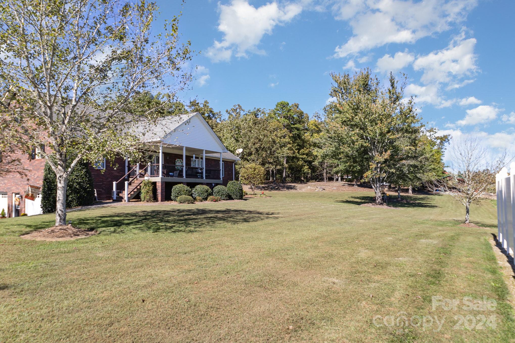 13512 Five Point Road Locust, NC 28097 - Photo 5 of 31 a front view of a house with a yard