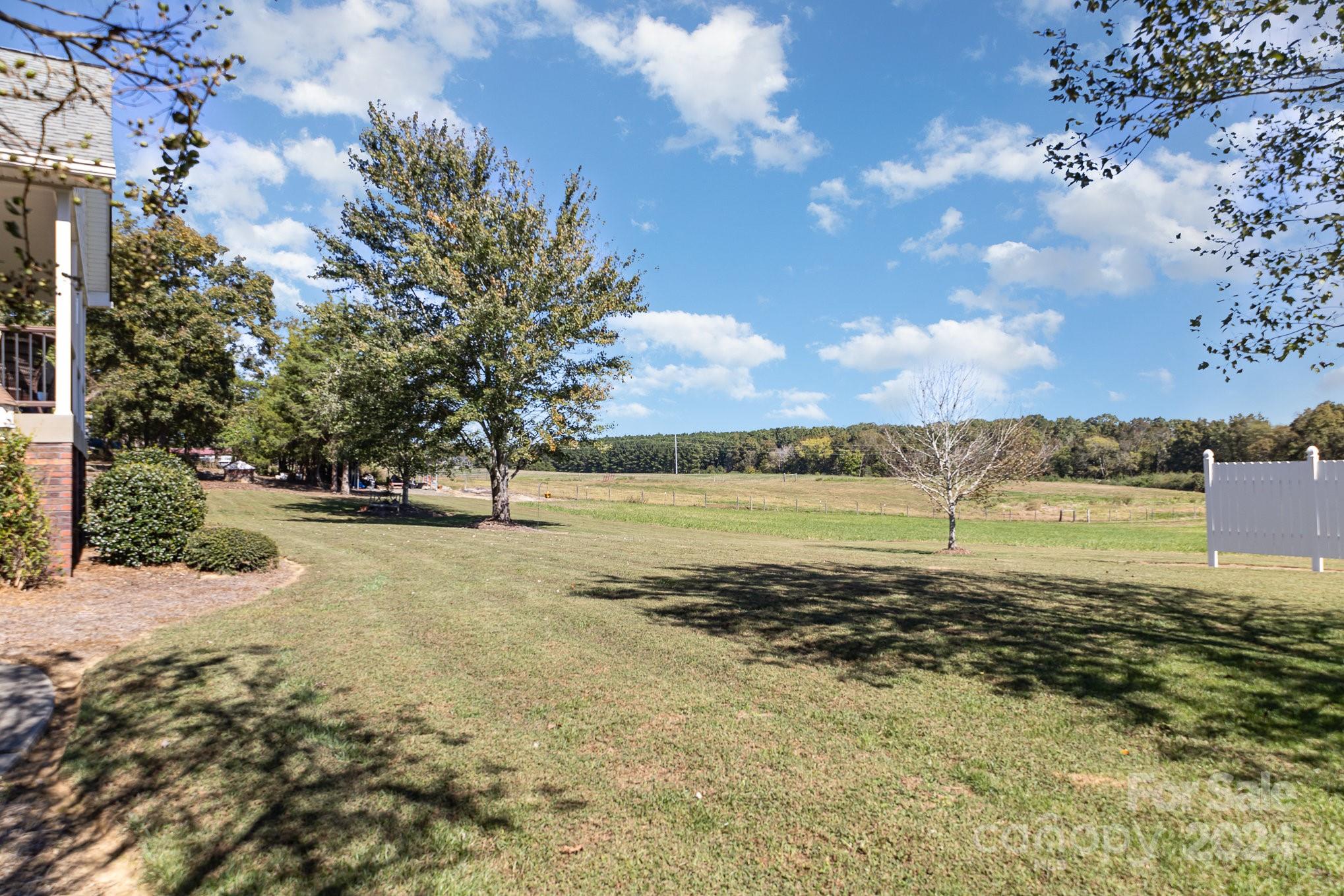 13512 Five Point Road Locust, NC 28097 - Photo 7 of 31 a view of a large body of water with lots of trees