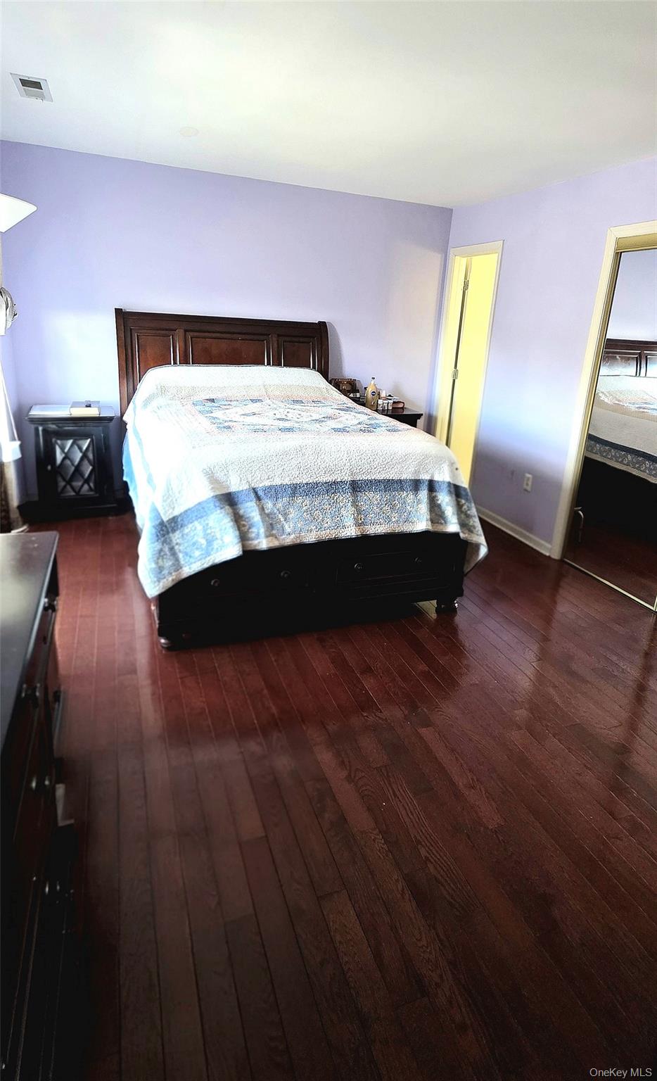 99 Evan Road Warwick, NY 10990 - Photo 11 of 20 a bedroom with a bed and wooden floor