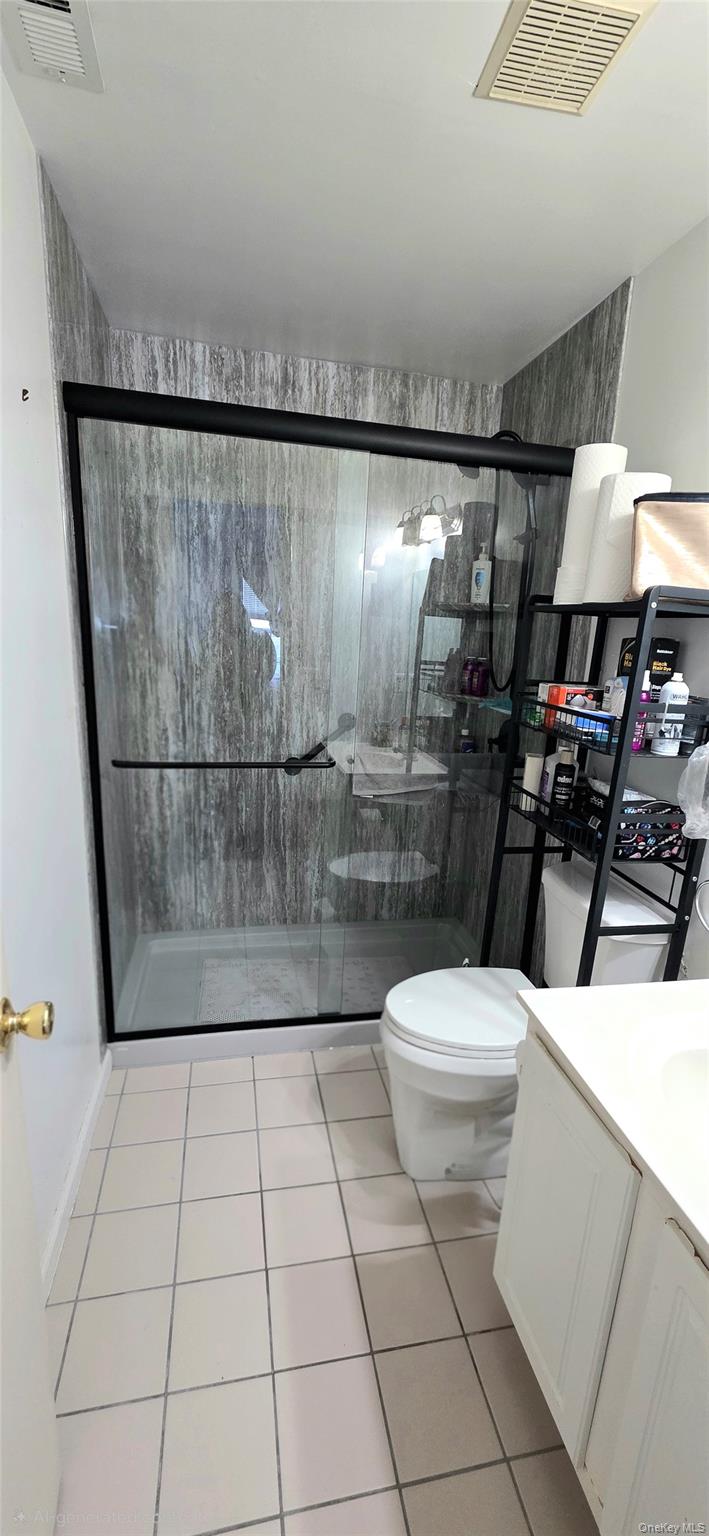 99 Evan Road Warwick, NY 10990 - Photo 13 of 20 a bathroom with a toilet a sink and a shower