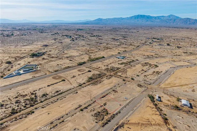 a view of an ocean beach and mountain