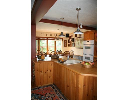 247 Mingo Loop Road Rangeley, ME 04970 - Photo 5 of 34 Kitchen. Kitchen opens into dining...