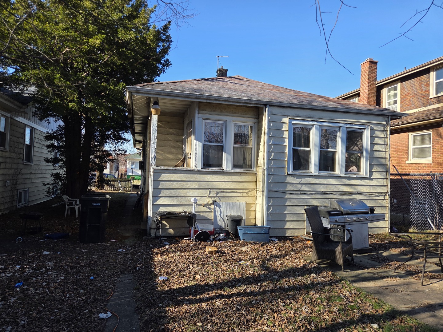 11341 South Normal Avenue Chicago, IL 60628 - Photo 7 of 7 a front view of a house with garden