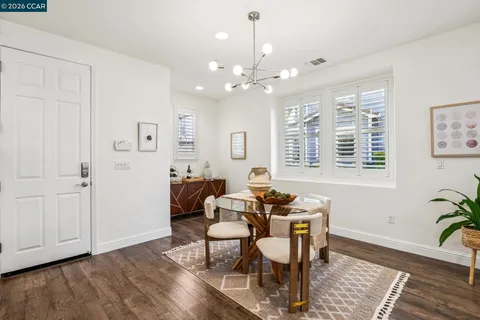 a view of a livingroom with furniture and a window