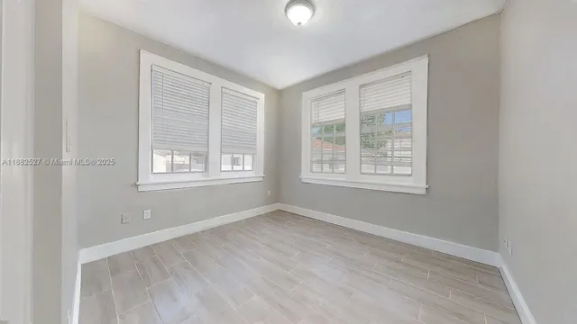 an empty room with windows