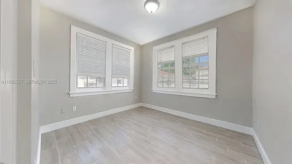 an empty room with windows