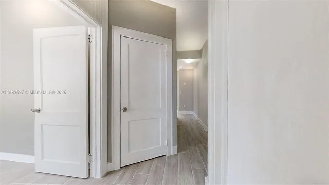 a view of a bathroom with wooden floor