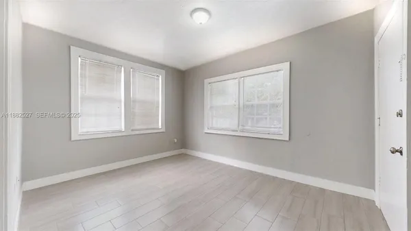 a view of an empty room with a window
