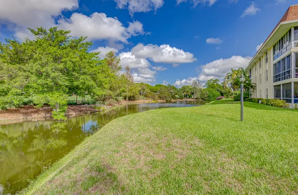 a view of a lake with a yard