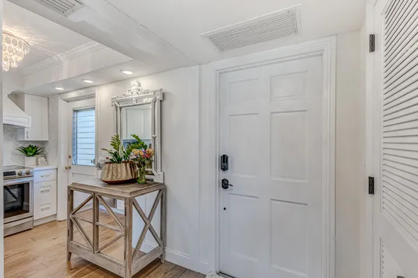 a room with wooden floor and furniture